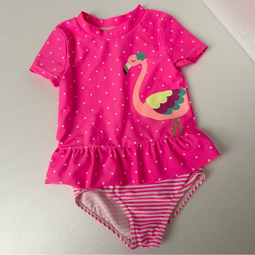 Carter’s 2-piece Pink polka dot short sleeve rashguard swimsuit size 12months.